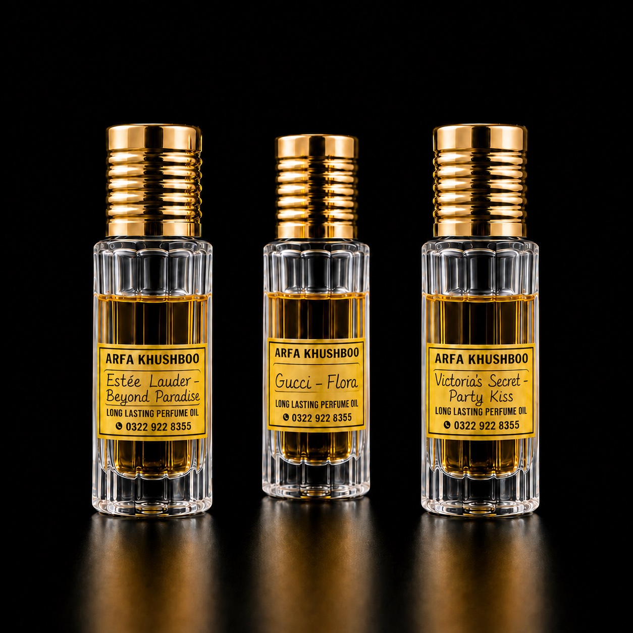 Three ARFA KHUSHBOO 6ml perfume oil bottles with gold caps and yellow handwritten labels reading Estee Lauder Beyond Paradise, Gucci Flora and Victoria's Secret Party Kiss